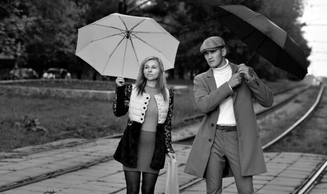 pair, lovers, street, city, railways, love story, a meeting, autumn, umbrella, together, man and woman, boy and girl, look into the distance, under the umbrella, point out, look out for, wait for the train, expectation, passengers, black and white, monochrome, bw