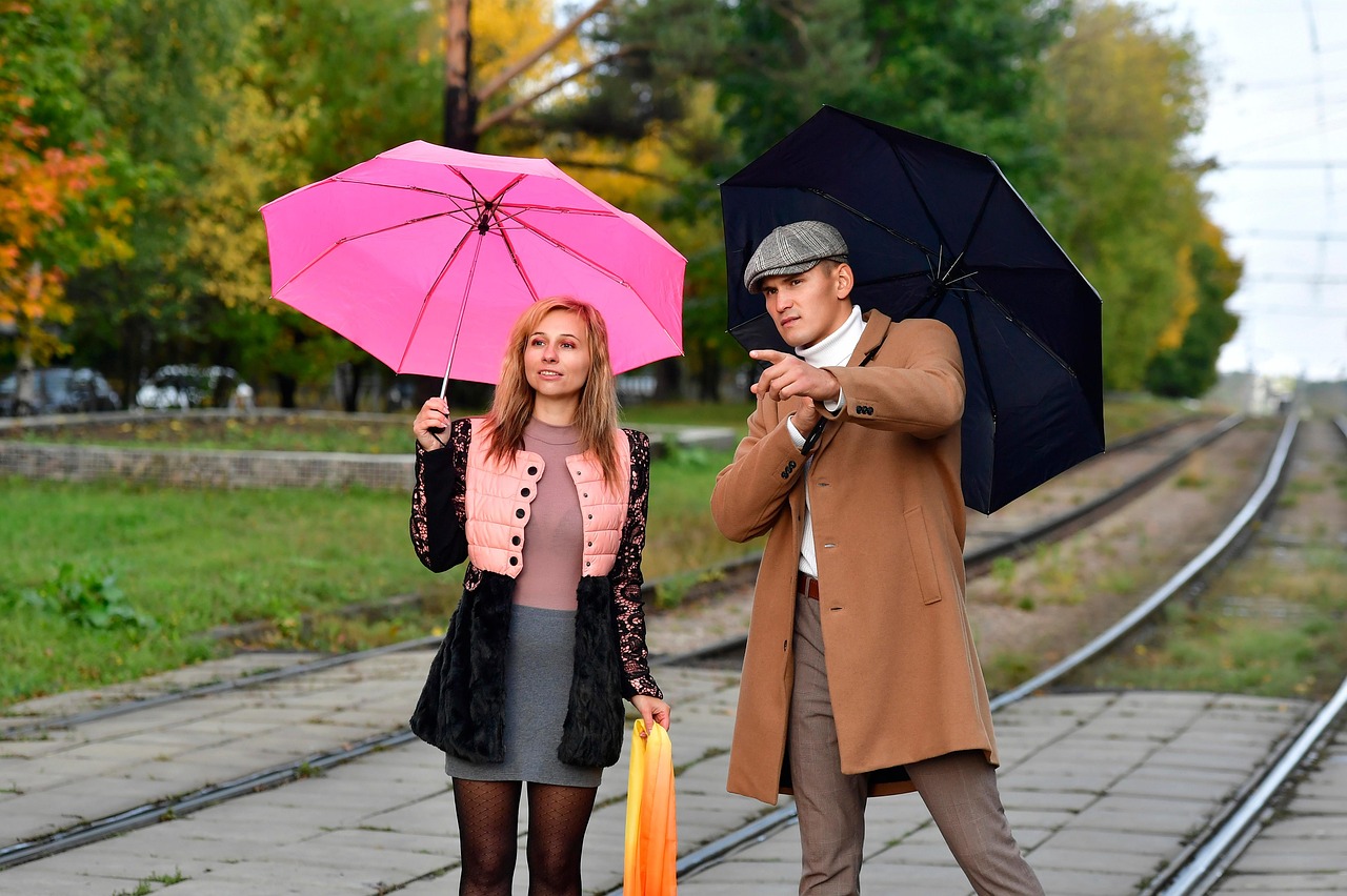 pair, lovers, street, city, railways, love story, a meeting, autumn, umbrella, together, man and woman, boy and girl, look into the distance, under the umbrella, point out, look out for, wait for the train, expectation, passengers